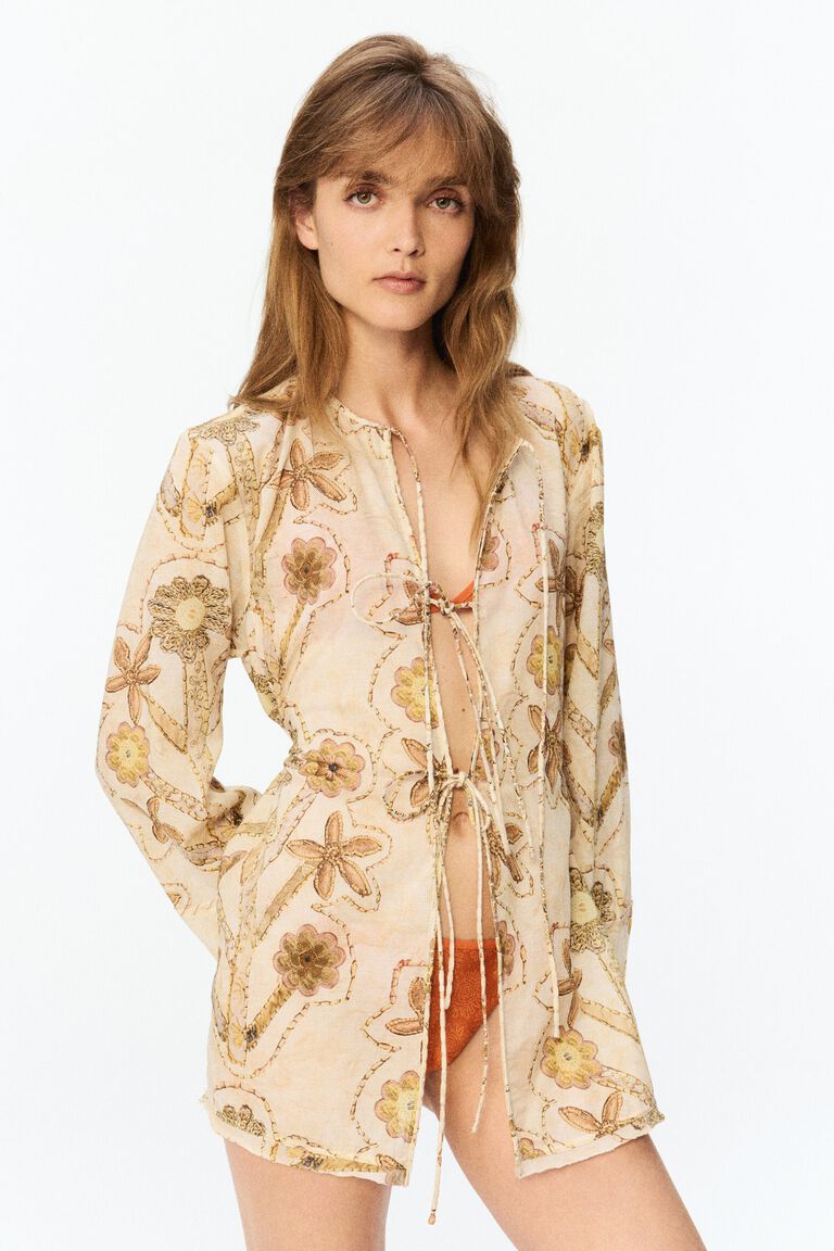 Blus ikat depan dengan motif bunga