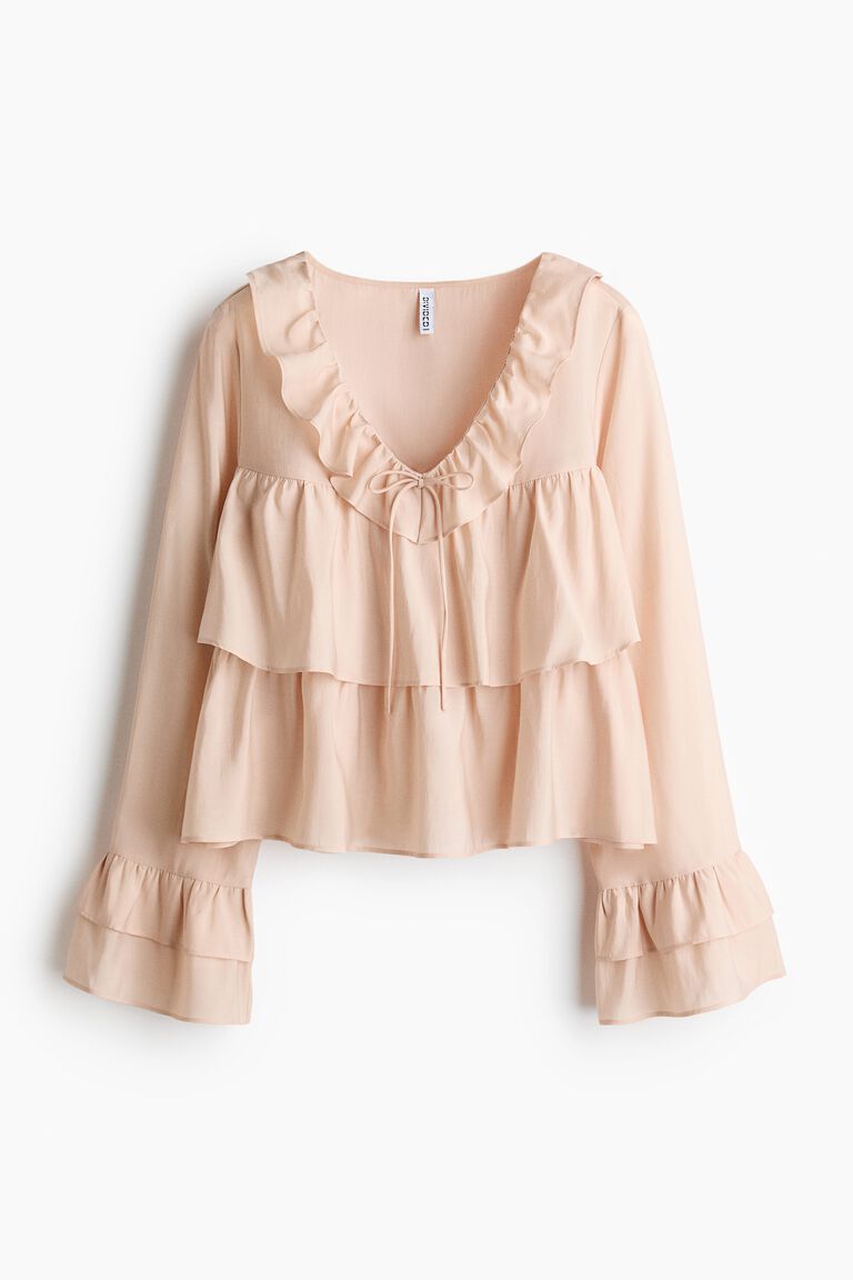 Blus dengan hiasan rumbai