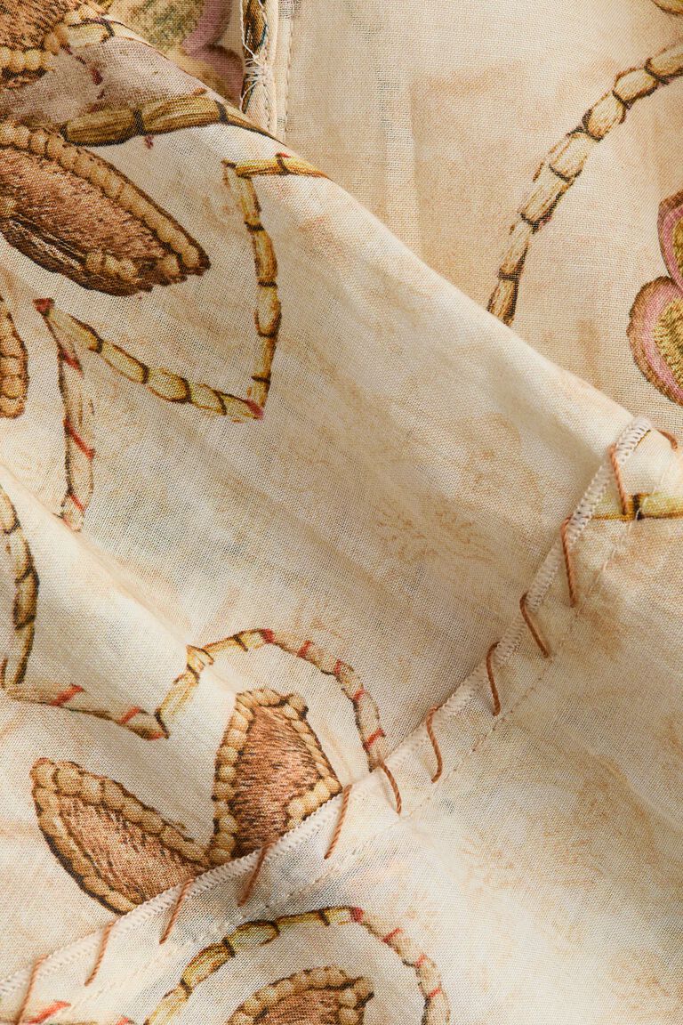 Blus ikat depan dengan motif bunga